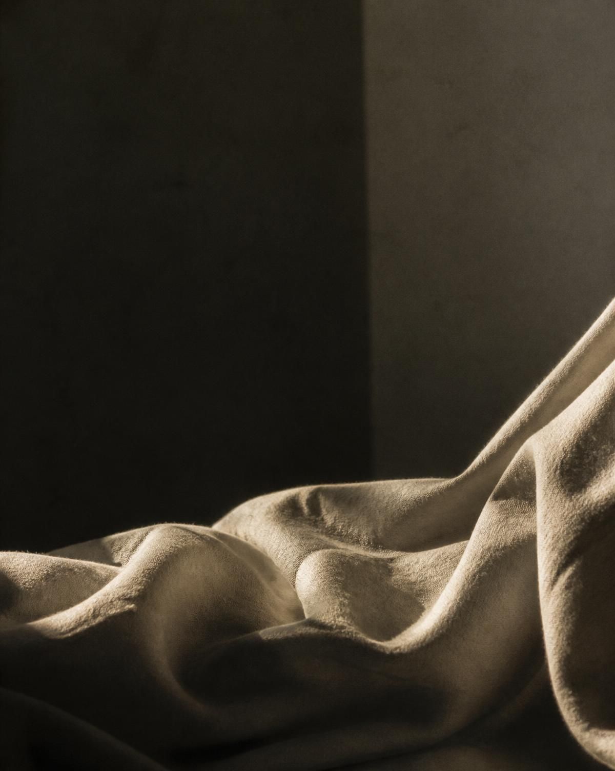 Folded linen in raking light